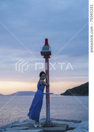 Woman in the sea of magic hour 79365281