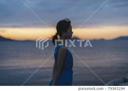 Woman in the sea of magic hour Woman in the sea of magic hour 79365294