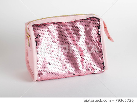 Pink shiny cosmetic bag on white background, isolate. Cosmetician 79365726