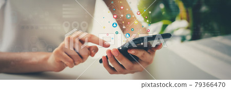 Woman hand using smartphone and show icon social media. Network technology concept. 79366470