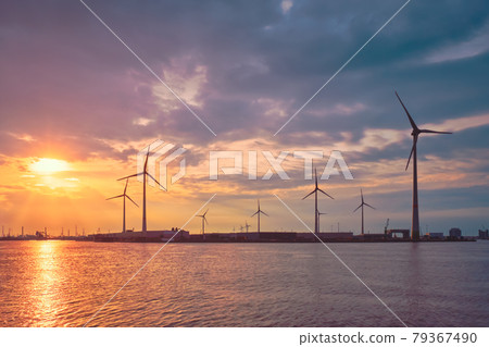 Wind turbines in Antwerp port on sunset. 79367490