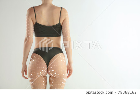 Perfect female body in black underwear over white background. Beauty fitness concept Perfect female body in black underwear over white background. Beauty fitness concept 79368162