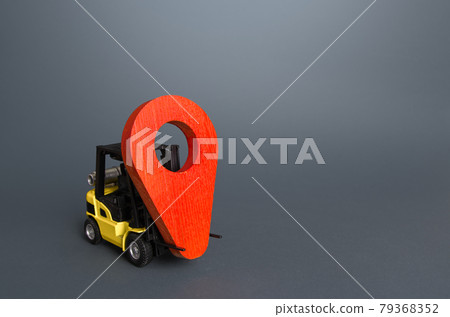 Yellow forklift carries a red location pin pointer. Transportation services and logistics, warehouse management. Real-time tracking of deliveries and goods. Freight infrastructure, redeployment Yellow forklift carries a red location pin pointer. Transportation services and logistics, warehouse management. Real-time tracking of deliveries and goods. Freight infrastructure, redeployment 79368352