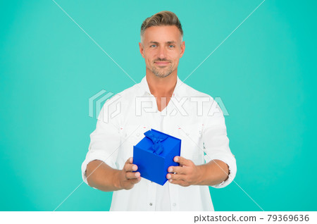 Heres to a fabulous birthday. Handsome man give birthday Heres to a fabulous birthday. Handsome man give birthday 79369636