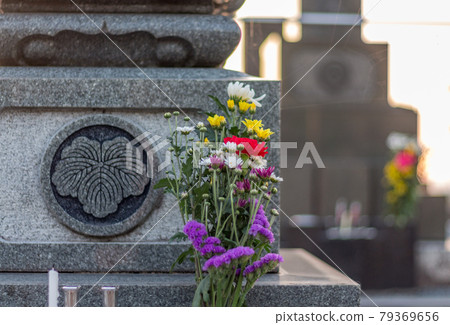 Offering of flowers, incense, candles on tomb. Kanazawa, Japan. 79369656