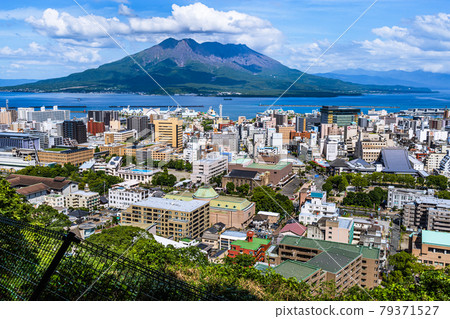 Sakurajima and Kagoshima cityscape seen from Shiroyama Park Observatory Sakurajima and Kagoshima cityscape seen from Shiroyama Park Observatory 79371527