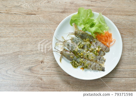 raw mantis shrimp dressing spicy and sour fish sauce Thai food on plate raw mantis shrimp dressing spicy and sour fish sauce Thai food on plate 79371598