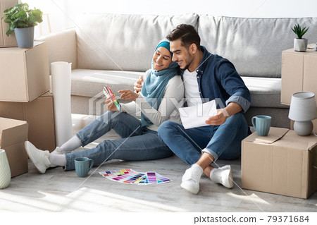 Creative muslim family working on design for new house Creative muslim family working on design for new house 79371684