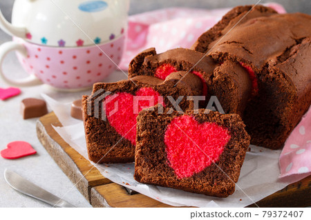 St. Valentine's Day, Mother's Day or Birthday festive dessert. Homemade sweet chocolate brownie with hearts for Valentine's Day on a stone countertop. 79372407