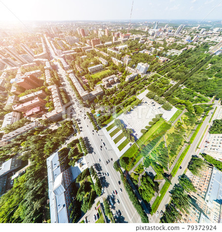Aerial city view with roads, houses and buildings. Aerial city view with roads, houses and buildings. 79372924