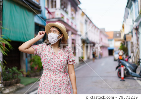 Travelers on street Phuket old town with Building Sino Portuguese architecture at Phuket Old Town area Phuket, Thailand. Travel concept 79373219