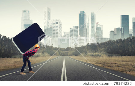 Builder man carry huge smartphone 79374223