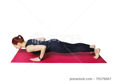 This is a slender woman doing push-ups with a narrow grip on a gym mat. Strengthening the triceps 79376667