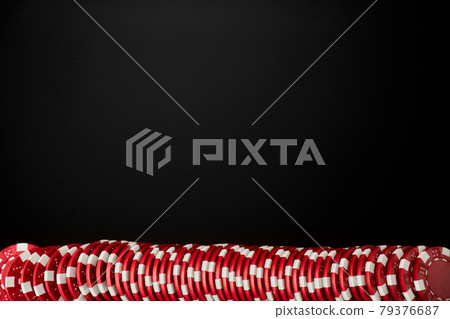 Stack of Casino gambling chips isolated on black reflective background 79376687