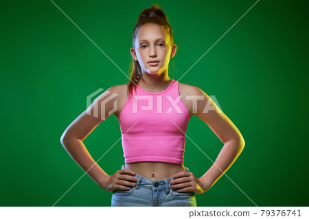 Fashion redhead girl teenager in t-shirt and jeans Fashion redhead girl teenager in t-shirt and jeans 79376741