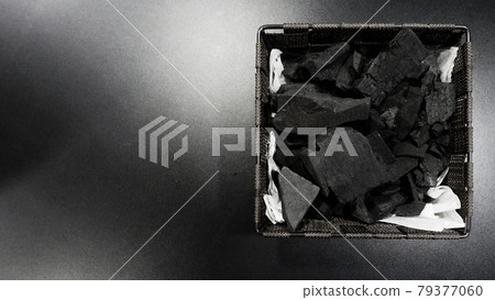 Black Charcoal on black textured floor. charcoal black carbon reesidue produced by strongly heating wood. Used for cooking or other industries. Natural wood charcoal. traditional hard wood charcoal. Black Charcoal on black textured floor. charcoal black carbon reesidue produced by strongly heating wood. Used for cooking or other industries. Natural wood charcoal. traditional hard wood charcoal. 79377060