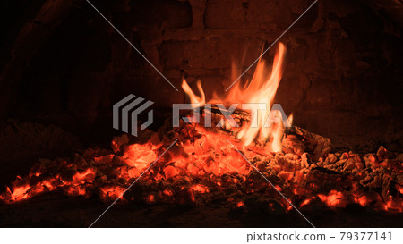 Logs of firewood burn out in the oven. Coals and flames in the fireplace. Logs of firewood burn out in the oven. Coals and flames in the fireplace. 79377141