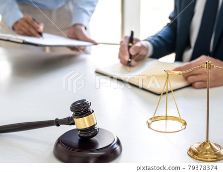 Businesswoman and Male lawyer or judge consult and conference having team meeting with client at law firm in office, Law and Legal services concept 79378374