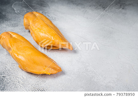 Smoked chicken breast fillet meat delicacy. White background. Top view. Copy space 79378950