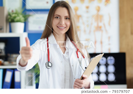 Woman doctor holding clipboard with documents and giving hand for handshake 79379707