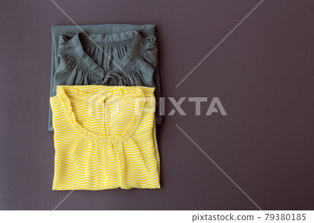 two women's blouses on a gray background 79380185