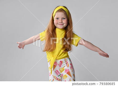 Studio shot of happy little red-haired girl child 79380685