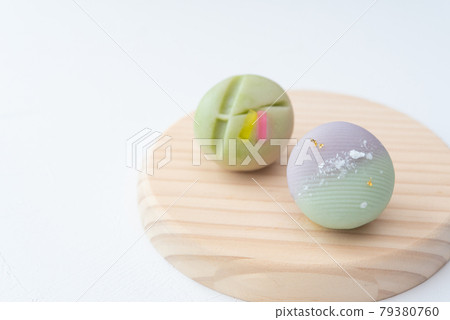 Tanabata Japanese sweets on a wooden plate, Milky Way bamboo leaves, strips of namagashi 79380760