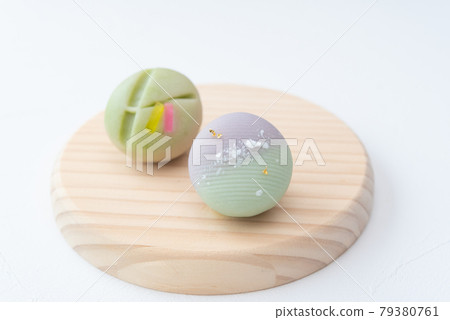 Tanabata Japanese sweets on a wooden plate, Milky Way bamboo leaves, strips of namagashi 79380761