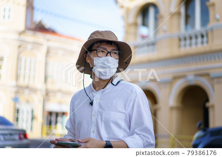 Travelers on street Phuket old town with Building Sino Portuguese architecture at Phuket Old Town area Phuket, Thailand. Travel concept 79386176
