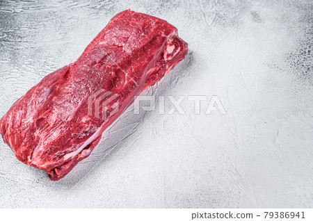 Raw Whole Tenderloin beef meat. White background. Top view. Copy space Raw Whole Tenderloin beef meat. White background. Top view. Copy space 79386941