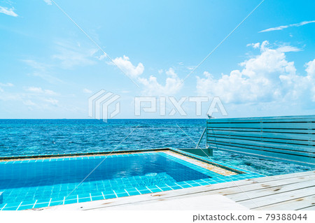swimming pool with sea background in Maldives swimming pool with sea background in Maldives 79388044
