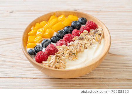 homemade yogurt bowl with raspberry, blueberry, mango and granola homemade yogurt bowl with raspberry, blueberry, mango and granola 79388333