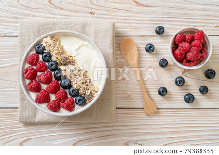 homemade yogurt bowl with raspberry, blueberry and granola homemade yogurt bowl with raspberry, blueberry and granola 79388335