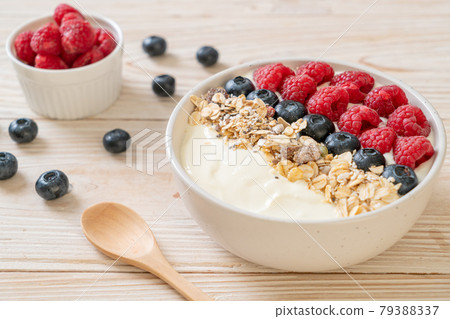 homemade yogurt bowl with raspberry, blueberry and granola homemade yogurt bowl with raspberry, blueberry and granola 79388337