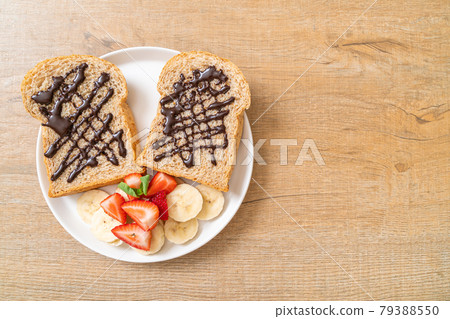whole wheat bread with fresh banana, strawberry and chocolate whole wheat bread with fresh banana, strawberry and chocolate 79388550