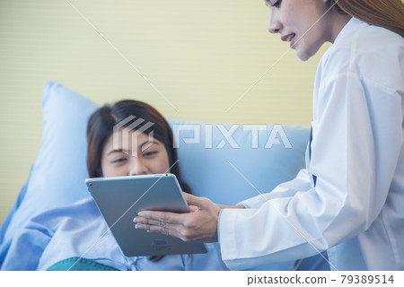 Woman doctor and patient consultation with professional specialist diagnostics at hospital medicare treatment clinic. Doctor writing prescription for medical health care therapy. Woman doctor and patient consultation with professional specialist diagnostics at hospital medicare treatment clinic. Doctor writing prescription for medical health care therapy. 79389514