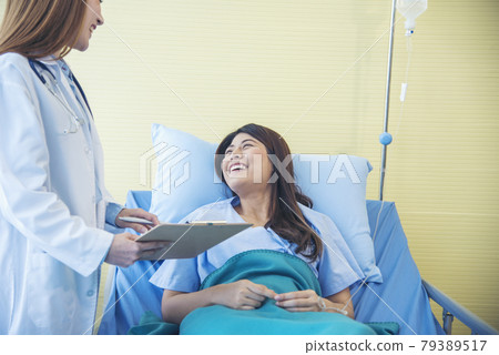 Woman doctor and patient consultation with professional specialist diagnostics at hospital medicare treatment clinic. Doctor writing prescription for medical health care therapy. Woman doctor and patient consultation with professional specialist diagnostics at hospital medicare treatment clinic. Doctor writing prescription for medical health care therapy. 79389517
