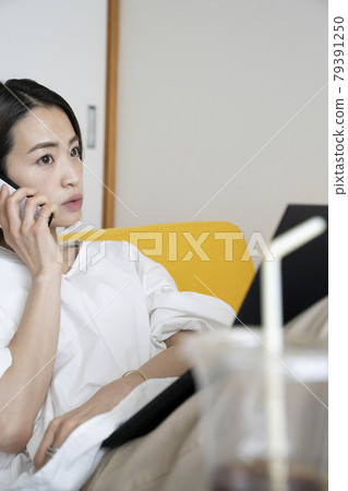 Woman doing telework at home Woman doing telework at home 79391250