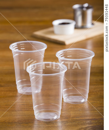 three cup of coffee on wood table 79391448