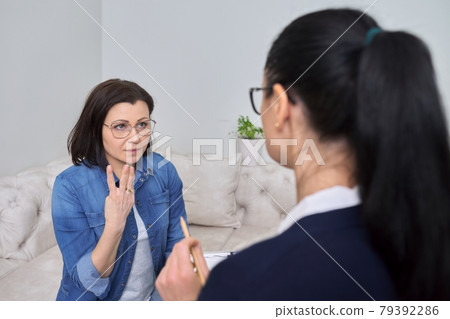 Middle-aged female at consultation of professional psychologist 79392286