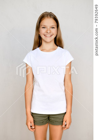 Portrait of teenager girl standing straight Portrait of teenager girl standing straight 79392649