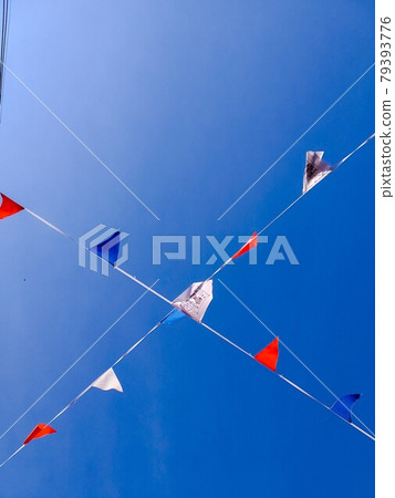 Flag swaying in the blue sky Flag swaying in the blue sky 79393776