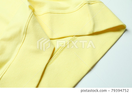 Yellow sweatshirt on white background, close up 79394752