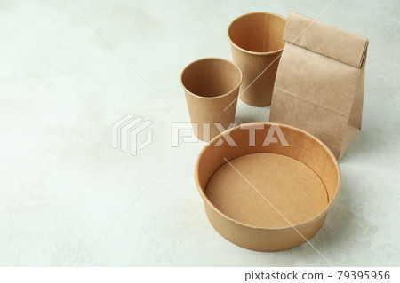 Delivery containers for takeaway food on white textured table Delivery containers for takeaway food on white textured table 79395956