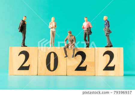 Miniature people : Business people standing on wooden block number 2022 79396937