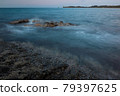 Waves and rocks shore long exposure 79397625