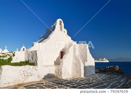 Famous tourist landmark, Mykonos, Greece. White Greek Orthodox church of Panagia Paraportiani, town of Chora on island at sunrise. Iconic destination Famous tourist landmark, Mykonos, Greece. White Greek Orthodox church of Panagia Paraportiani, town of Chora on island at sunrise. Iconic destination 79397639