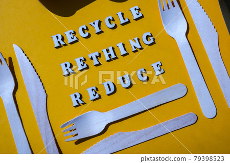 RECYCLE RETHING REDUCE text Wooden forks and paper cups with plates on color background. Eco friendly disposable tableware. Used in fast food, restaurants, takeaways, picnics. No plastic RECYCLE RETHING REDUCE text Wooden forks and paper cups with plates on color background. Eco friendly disposable tableware. Used in fast food, restaurants, takeaways, picnics. No plastic 79398523