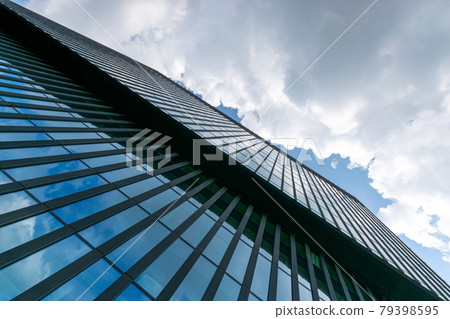 City buildings glass. Modern office business building with glass, steel facade exterior. Finance corporate architecture city in abstract blue sky with nature cloud in sunny day. City buildings glass. Modern office business building with glass, steel facade exterior. Finance corporate architecture city in abstract blue sky with nature cloud in sunny day. 79398595