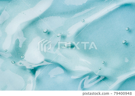 Transparent hyaluronic acid gel on a blue background. Transparent hyaluronic acid gel on a blue background. 79400948